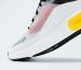 Stylish sneaker showcasing vibrant colors on a clean white backdrop.